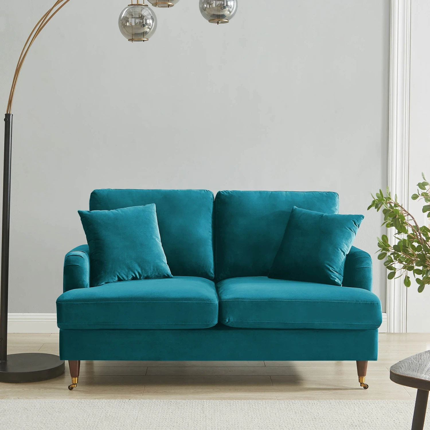 Brigette 2-Seater Teal Velvet Sofa With Antique Brass Castor Legs 1 Brigette 2-Seater Teal Velvet Sofa With Antique Brass Castor Legs