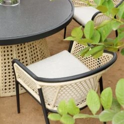 Pienza Outdoor Rattan 6-Seater Round Dining Set, Oatmeal Fabric With Black Frame 17 Pienza Outdoor Rattan 6-Seater Round Dining Set, Oatmeal Fabric With Black Frame -Daals Store OD DINE 2227 BLACK OAT SET scene3