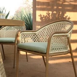 Pienza Outdoor Rattan 6-Seater Round Dining Set, Sage Green Fabric With Light Walnut Frame 17 Pienza Outdoor Rattan 6-Seater Round Dining Set, Sage Green Fabric With Light Walnut Frame -Daals Store OD DINE 2227 WALN GREEN SET scene3