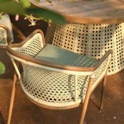 Pienza Outdoor Rattan 6-Seater Round Dining Set, Sage Green Fabric With Light Walnut Frame 19 Pienza Outdoor Rattan 6-Seater Round Dining Set, Sage Green Fabric With Light Walnut Frame -Daals Store OD DINE 2227 WALN GREEN SET scene5